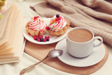 breakfast with coffe and tasty cakes in bed