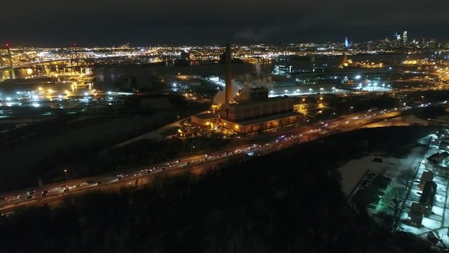 Aerial Footage Flying Towards Philadelphia PA Skyline at Night After Snowfall