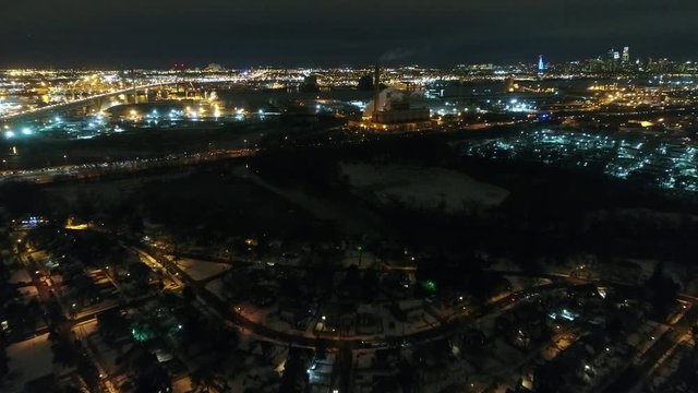 Aerial Footage Flying Towards Philadelphia PA Skyline at Night After Snowfall