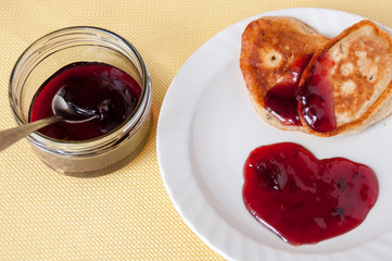 Delicious pancakes for breakfast with cherry jam