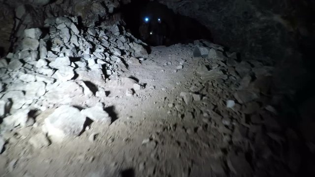 a guy with a torch goes to the cave
