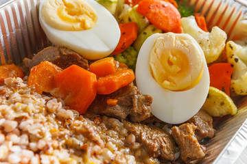 Healthy food take away in foil box, meat and vegetables