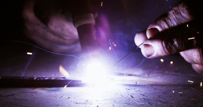 Close-up of welder using welding torch in workshop 4k