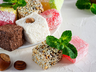 Turkish delight on white rustic background