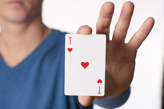 Man holding ace of hearts in hand, Chance or Risk of Love Concept