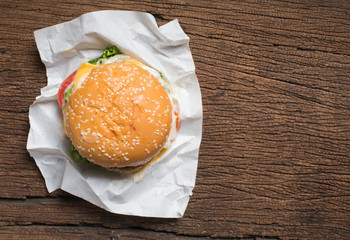 Fresh homemade burger cheeseburger on wooden ,top view
