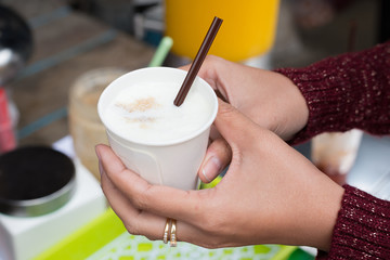 Hot milk and sugar in cup