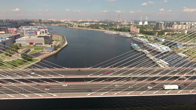 Aerial view at the cable-stayed Bolshoy Obukhovsky Bridge and Utkina Zavod district. Neva river. City ringroad (KAD) is on the bridge. St. Petersburg, Russia
