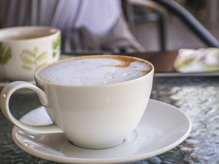 Coffee cup on a table.