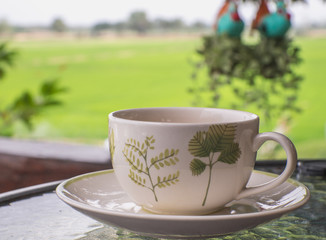 Coffee cup on a table.
