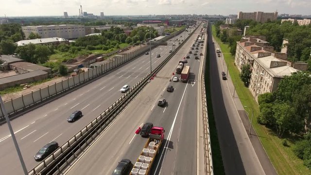 City ring highway leads to south-west. Road part is in the Rybatskoye municipality, Nevsky sleeping district. Aerial view. St. Petersburg, Russia
