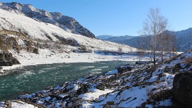 Ice thawing of on the river in the early spring, Katun River, Altai, Russia