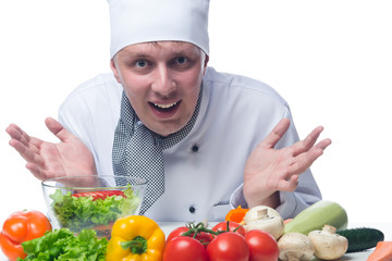 chef showing his hands in front of a vegetable salad