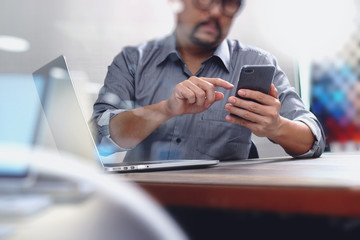 Businessman hand using mobile payments online shopping,pencil,om