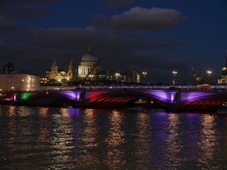 London cityscape of BlackFriars Bridge at night with St. Paul's cathedral in the background 