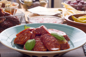 Chorizo sausage on old plate