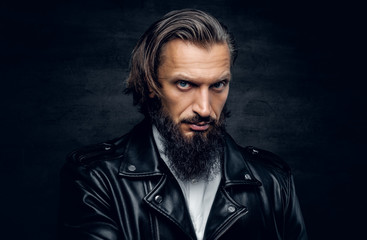 Fototapeta premium A man in a black leather jacket.