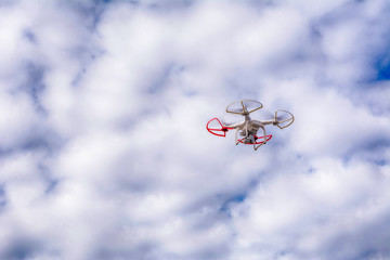 Drone flying on the sky background