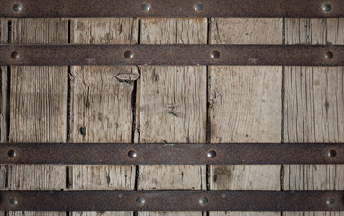Metal plate with screws over the wooden background