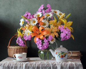 country still life with lilies and utensils for tea. © Masquerade