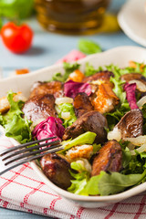 Warm salad with grilled chicken liver and toast