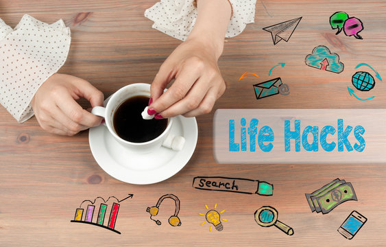 Life Hacks. Coffee cup top view on wooden table background.
