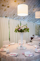 restaurant table setting with chandeliers