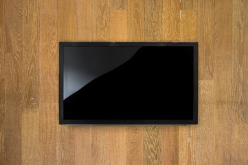 Black LED tv television mockup, blank on brown wooden background