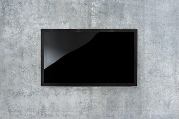 Black LED tv television mockup, blank on gray concrete background