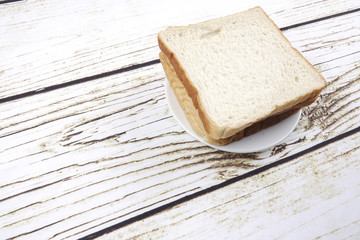 bread slices over old rustic wooden background, top view, copy space, horizontal composition
