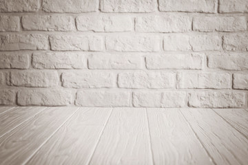 White background of bricks wall and wooden floor with spotlight
