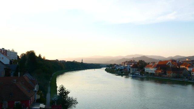 Sunset over the River Drava flowing through Maribor, Slovenia, Europe.