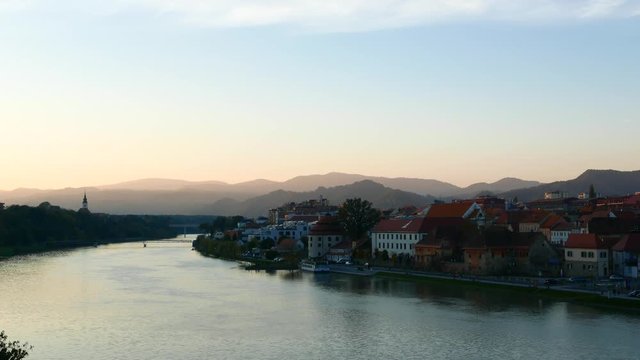 Sunset over the River Drava flowing through Maribor, Slovenia, Europe.
