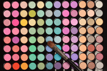 Colorful makeup background with brush