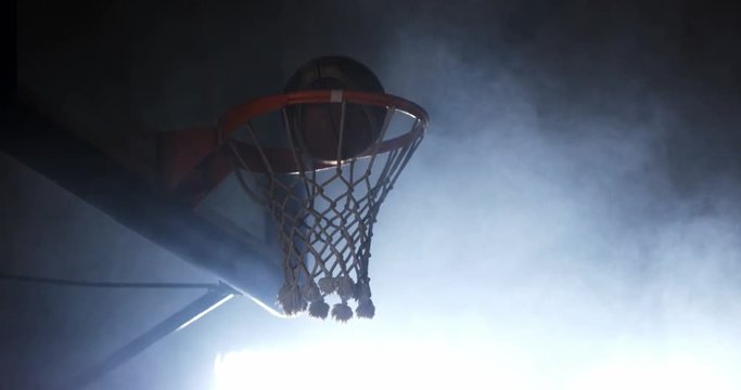 Sportsman dunking basketball in hoop at basketball court 4k
