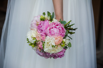 Beautiful bride with bouquet before wedding ceremony
