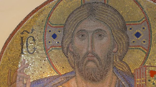 a Half Round Icon of Jesus Christ Keeping Bible, Made of Golden Looking Mosaic, in Chalk Caves of Sviatogorskaya Lavra in Winter