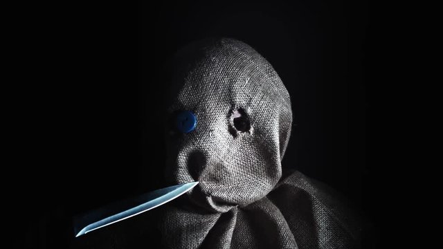4K Horror Scarecrow with Sackcloth Mask Holding Knife