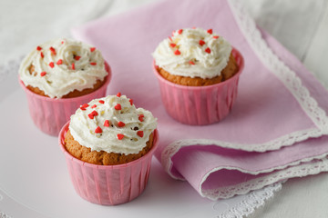 Muffins with heart decorations