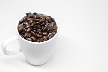 Coffee beans in cup.