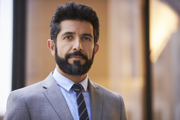 Fototapeta premium Middle aged Hispanic businessman looking to camera