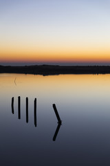 sunset with reflection in still water over nature reserve Casse de la Belle Henriette, Vendee, France