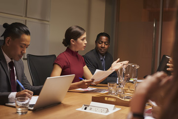 Female manager addressing team at a business meeting