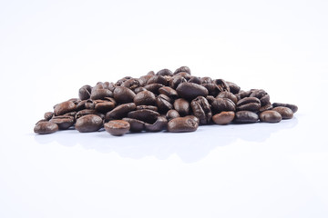 roasted coffee beans isolated in white background