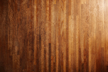 Rich texture of wooden table or floor made of many thin long racks placed vertically, top view, natural rustic background