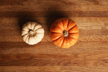 Green eucalyptus branch isolated on rich textured wooden rustic table top view, top view