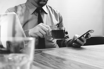 success businessman hand using smart phone,digital tablet dockin