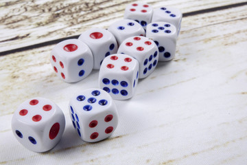 White dice on wooden background.  Concept of luck, chance and leisure fun.