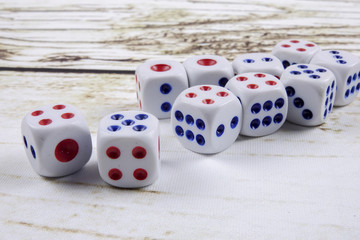White dice on wooden background.  Concept of luck, chance and leisure fun.