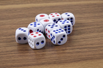 White dice on wooden background. Concept of luck, chance and leisure fun.